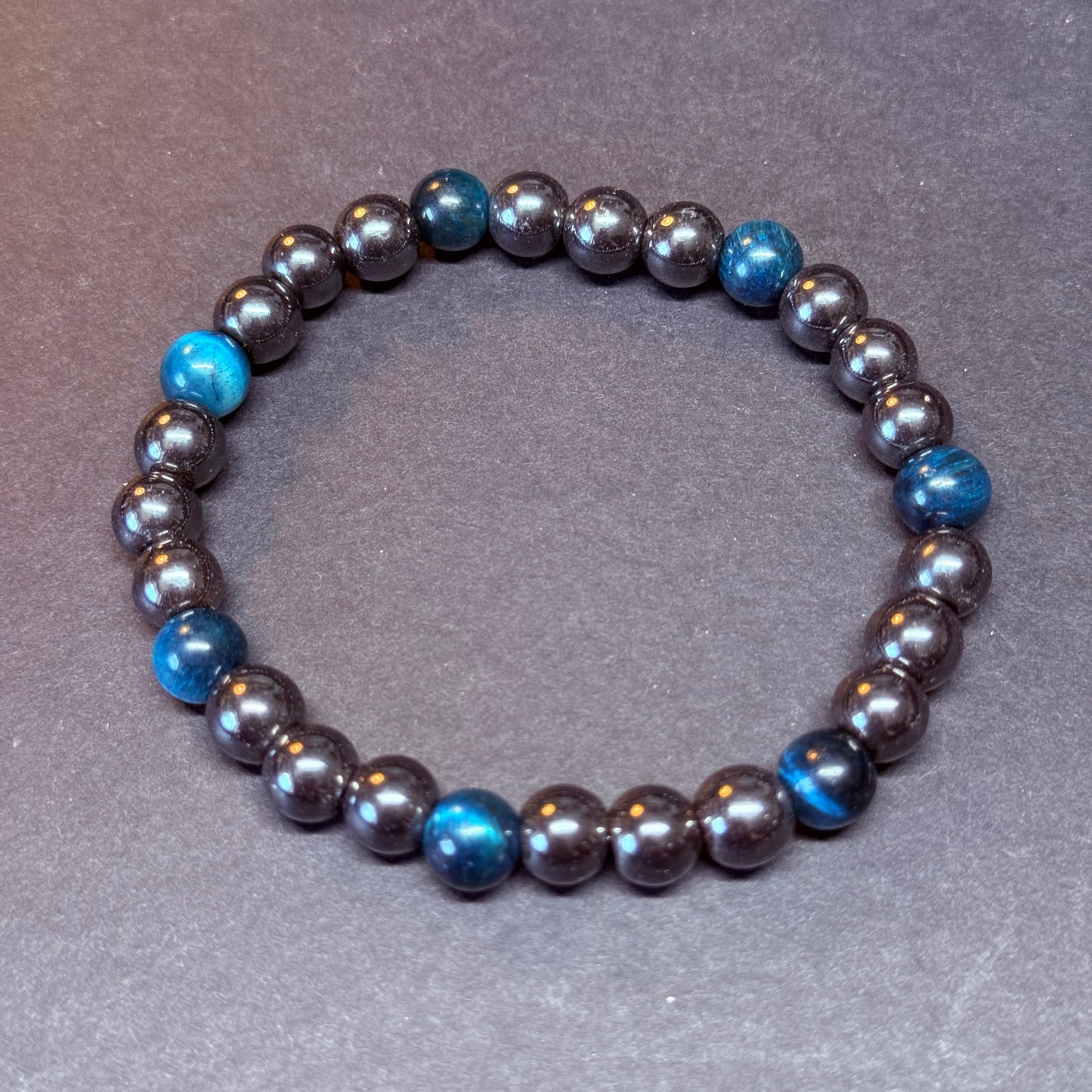 HÄMATIT Kugelarmband Tigerauge blau